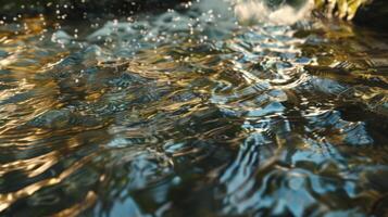 Water flowing over rocks and grass photo