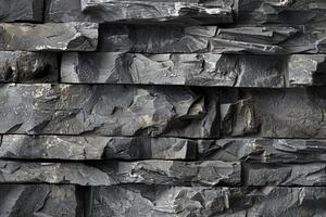 A wall made of stone with many different shapes photo