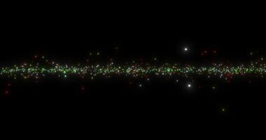 Sparkling particles flying in the same plane. Multi-colored flying particles on a black background. Abstract animation. 1 video