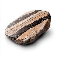 a single piece of a gneiss with banded texture on white background photo