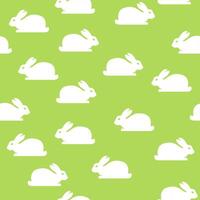 Seamless green pattern with bunnies vector
