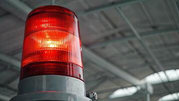 Red rotating beacon used for alert in industrial setting video