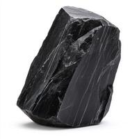 single piece of dark basalt with rough texture on white background photo