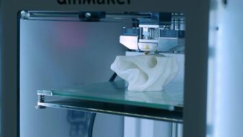 Modern 3D printer printing figure close-up macro.Automatic three dimensional 3d printer performs plastic white color modeling in laboratory. 3d-printing processing with white background 8 video