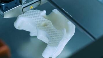 Modern 3D printer printing figure close-up macro.Automatic three dimensional 3d printer performs plastic white color modeling in laboratory. 3d-printing processing with white background 7 video