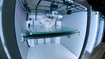 Modern 3D printer printing figure close-up macro.Automatic three dimensional 3d printer performs plastic white color modeling in laboratory. 3d-printing processing with white background 2 video