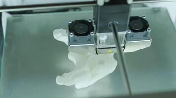 Modern 3D printer printing figure close-up macro.Automatic three dimensional 3d printer performs plastic white color modeling in laboratory. 3d-printing processing with white background 4 video