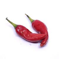 A photo of two red chilies with a vibrant color and glossy texture, giving a spicy and intense appearance.