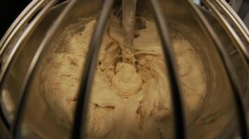 Close-up of dough mixing in a professional kneader machine in kitchen of bakery or at the manufacturing. Stock footage. Dough making process 5 video