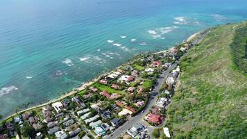 Aerial view of Hawaiian beachfront neighborhood, Drone view of a coastal residential area in Hawaii with turquoise waters video