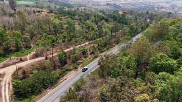 An empty mountain road extending into the distance, symbolizing adventure and exploration. video