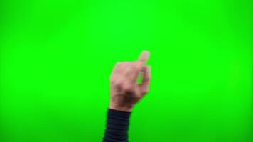 Pack of videos a male hand perform multiple gestures. Finger swipes from left to right multiple times on green screen chroma key background