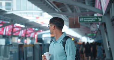 Man glasses enjoys coffee, abruptly turns sprints his train critical moment time, capturing essence race against time, each second truly counts. Race against time, epitomizes urgency. video