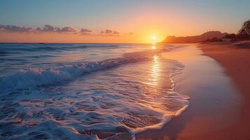 Golden sunset over a tranquil beach with waves lapping at the shore. photo