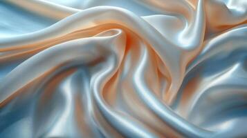 Smooth, flowing, luxurious satin fabric drapes in soft peach and cream tones. photo