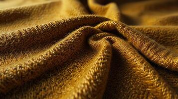 textured wool cloth surface in warm mustard yellow, under the harsh midday sun, emphasizing the thick, cozy texture and visible fibers. Include sharp, high-contrast shadows photo