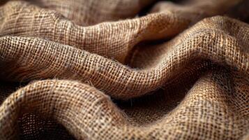 Close-up view of natural burlap fabric texture with intricate weave patterns. photo