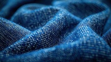 Close-up view of deep blue fabric with intricate weave texture. photo