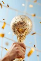 Triumphant Trophy Moment in Soccer Goal photo