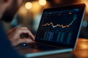 Investor Analyzing Portfolio and Investment Data on Laptop Screen photo