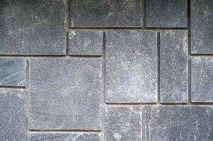 A pattern of grey paving street tiles. photo