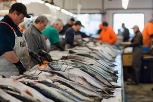 People are standing around a table with fish on it photo