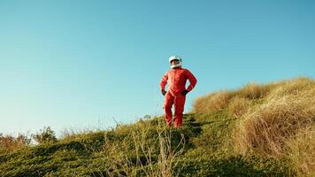 Astronaut Man Goes Down A Hill Into The New Planet Vegetables Exploration photo