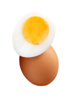 Raw brown chicken egg and cooked or boiled chicken egg with egg yolk in half in small pile isolated with clipping path in file format png
