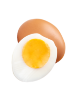 Cooked or boiled chicken egg with egg yolk in half and raw brown chicken egg in small pile isolated with clipping path in file format png