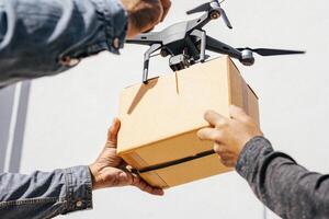 Drone Delivering Package To A Person, Customer Receiving A Parcel From A Drone photo