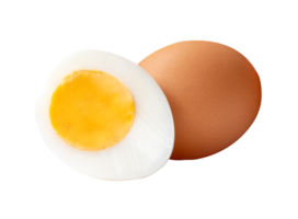 Front view of raw brown chicken egg and cooked or boiled chicken egg with egg yolk in half in small pile isolated with clipping path in file format png