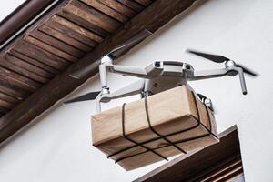 Drone Delivering A Package To A Building Modern Innovative Parcel Delivery Solutions photo
