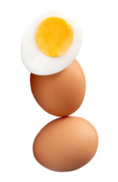 A vertical stack of raw brown chicken eggs and cooked or boiled chicken egg with egg yolk in half isolated with clipping path in file format png