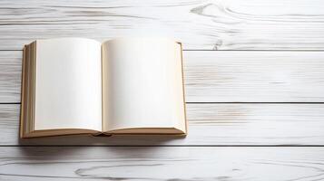 Open book with empty blank pages, flat lay on white wooden background photo