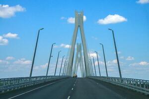 A modern cable-stayed bridge with road and street lighting. photo