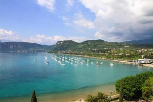 Picturesque view of the harbor with sailboats on the turquoise lake. photo