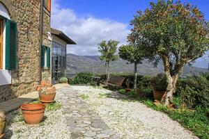 The rustic architecture, greenery and tranquil atmosphere create the perfect retreat for relaxation and travel inspiration. photo