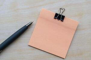 Top view of light pink color notepad with customizable space for text photo