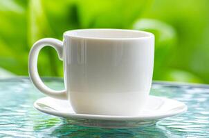 Close up of white cup with customizable space for mockup photo