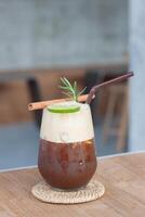 a drink with cinnamon and a cinnamon stick photo