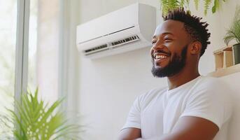 Smiling man enjoying a comfortable indoor environment with air conditioning photo
