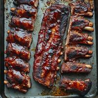 A tray of ribs on a baking sheet photo