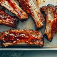 Barbecue ribs on a baking sheet photo