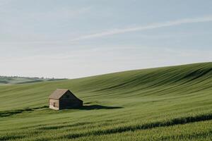 Rustic farmhouse on rolling green hills photo