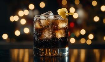 Refreshing, festive cocktail with ice and lemon twist photo