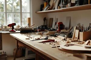 Artisan woodworking workshop. A cluttered workbench filled with wood pieces, tools, and sawdust, with a view of a sunlit window photo