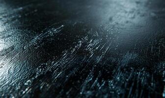 Dark, textured surface with subtle highlights photo