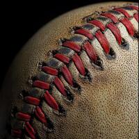 Close-up of a weathered baseball. Detailed view of the aged leather and stitching photo