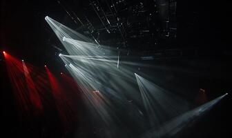 A stage with lights and beams of light photo