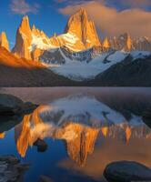 The mountain range is reflected in the water photo